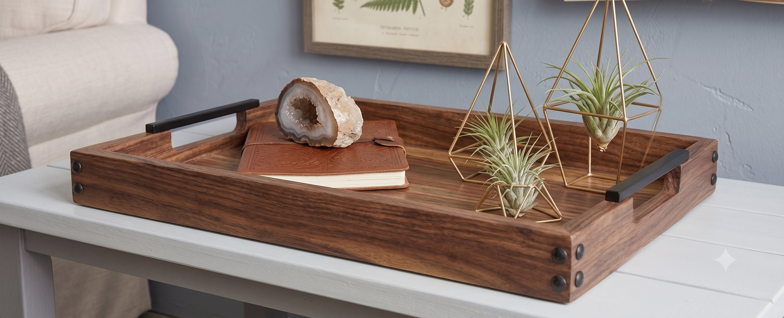 Dark wood serving tray styled with plants and books